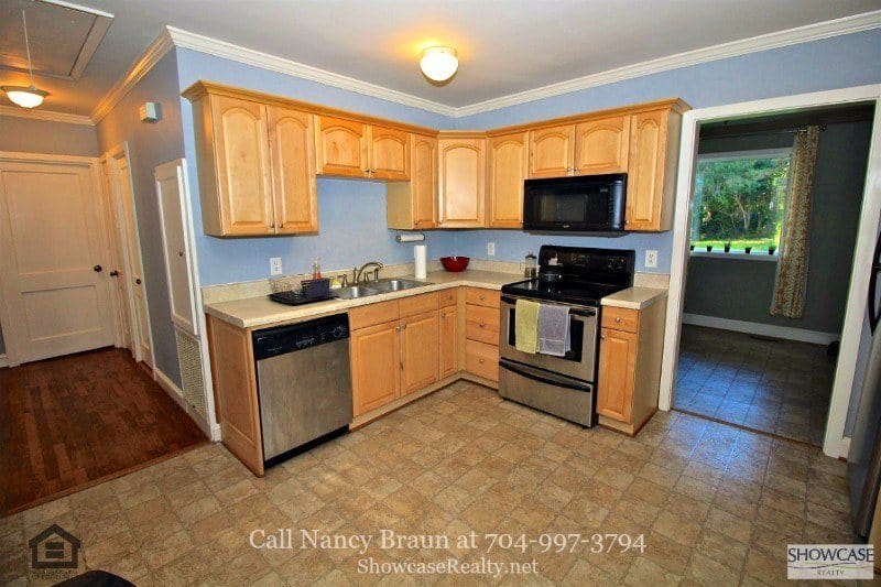 Charlotte NC Homes for Sale - The kitchen of this Charlotte home has all the modern appliances you’ll need to whip up great meals. Charlotte NC Real Estate Properties for Sale