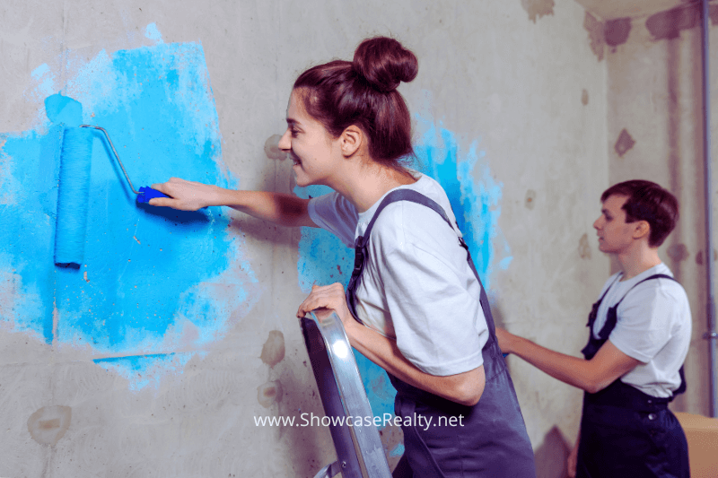 Transform your Charlotte NC home and increase its value through renovation, as depicted by painting in a new house.