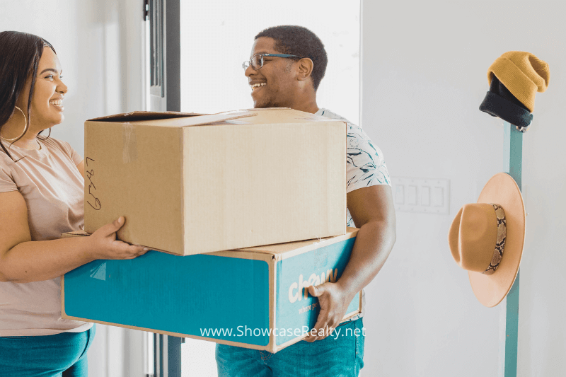 Excited couple moving in, highlighting the appeal of Charlotte North Carolina homes for sale.