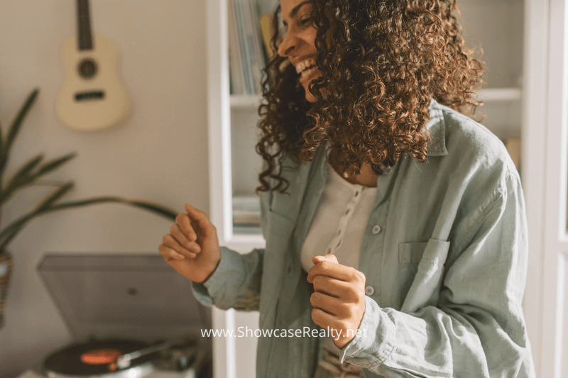 Inviting interior of a Charlotte NC investment property, capturing a moment of a woman dancing to music.