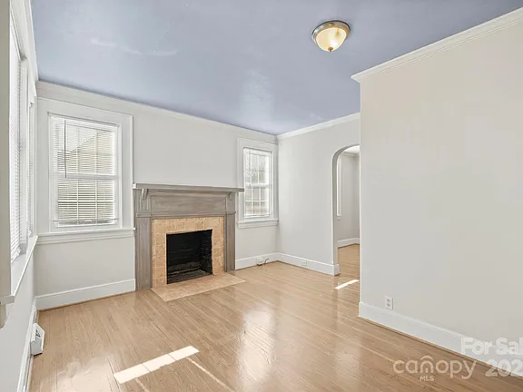 Living Room with fireplace and gleaming wood floors throughout the home. Charlotte,North Carolina,Open House