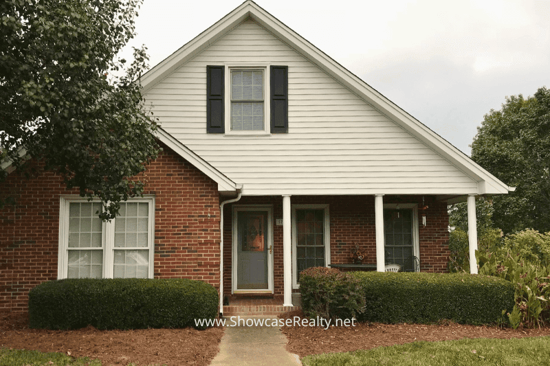 Charming brick and vinyl home in the Lake Park community near Charlotte NC, ideal for home buyers seeking a unique real estate opportunity with Showcase Realty’s expert guidance.
